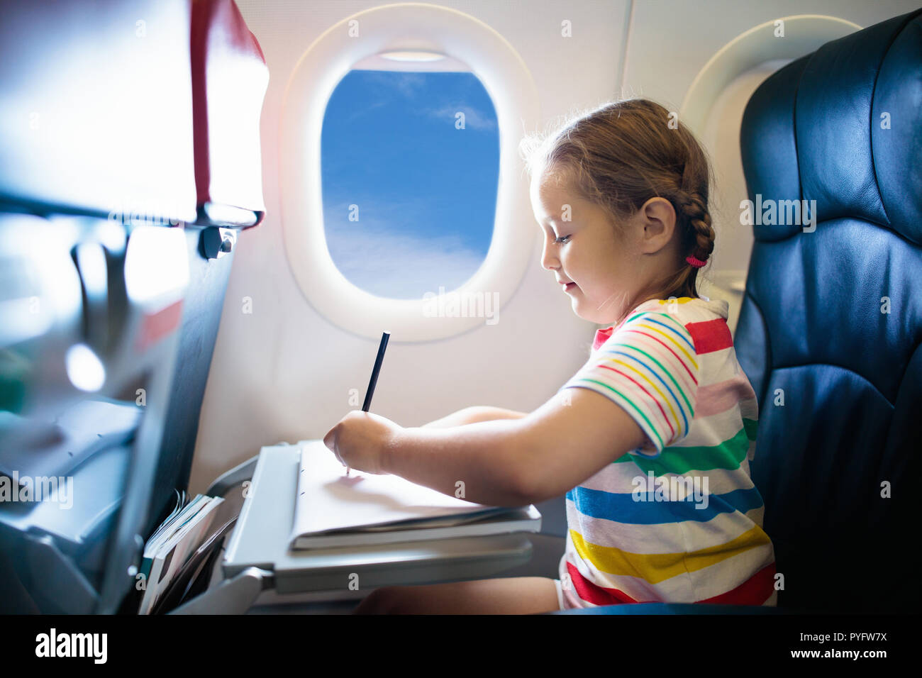 Child In Airplane Kid In Air Plane Sitting In Window Seat Flight Entertainment For Kids Traveling With Young Children Kids Fly And Travel Family Stock Photo Alamy Child In Airplane Kid In Air Plane Sitting In Window Seat Flight Entertainment For Kids Traveling With Young Children Kids Fly And Travel Family Stock Photo Alamy