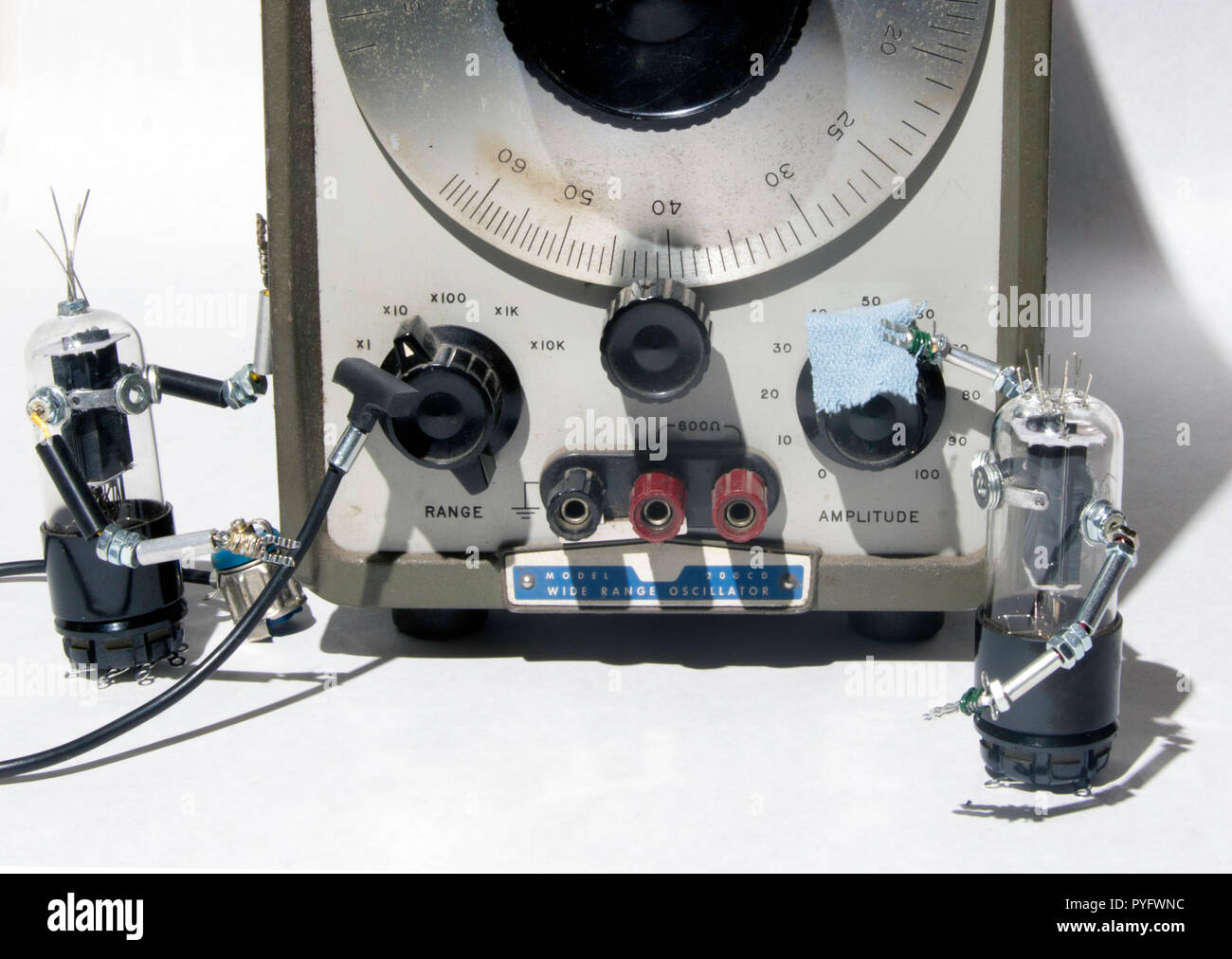 Robot figures cleaning vintage electronic equipment Stock Photo Alamy