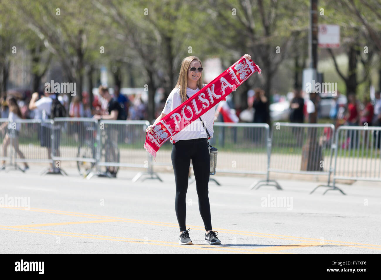 Chicago, Illinois, USA - May 5, 2018: The Polish Constitution Day Parade, Young polish woman holding a banner that says Polska during the parade Stock Photo