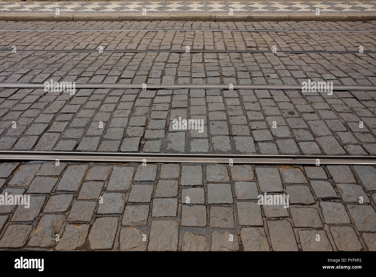 Top view of cobblestone street, texture, background. Stock Photo