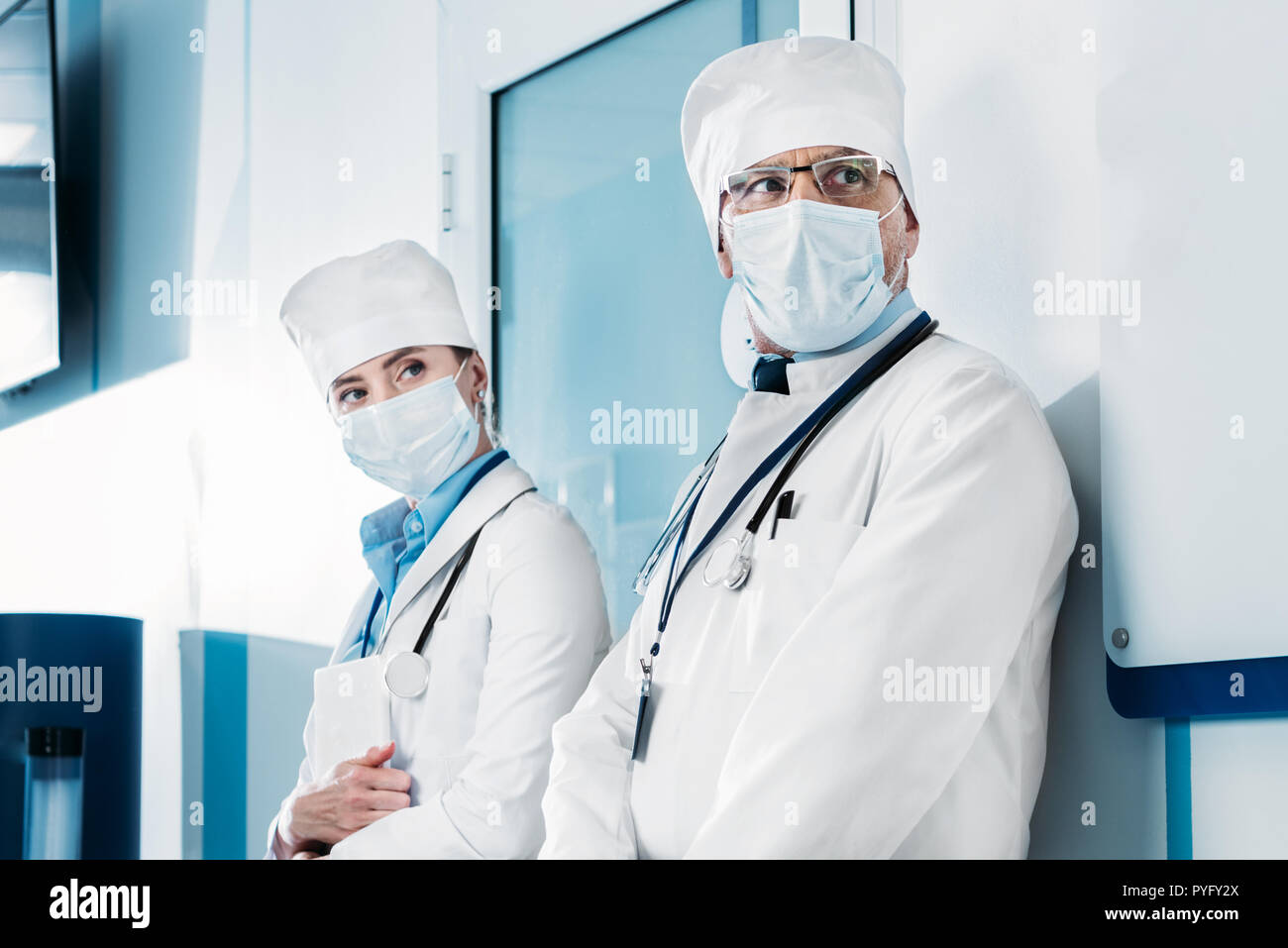 Male female doctors masks hi-res stock photography and images - Alamy