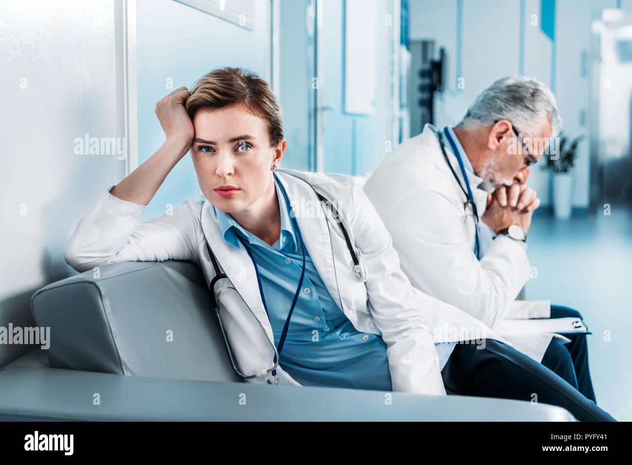 Tired female doctor hi-res stock photography and images - Alamy