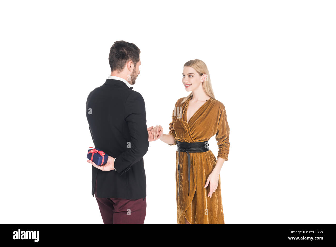 stylish man surprising smiling girlfriend with present isolated on white Stock Photo