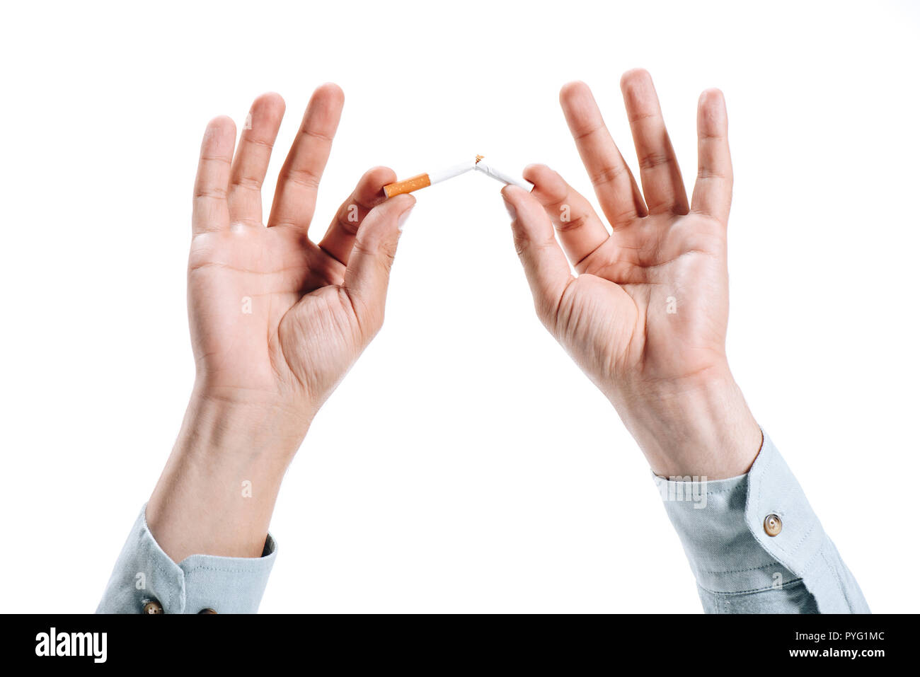 cropped image of man in shirt breaking unhealthy cigarette isolated on white Stock Photo