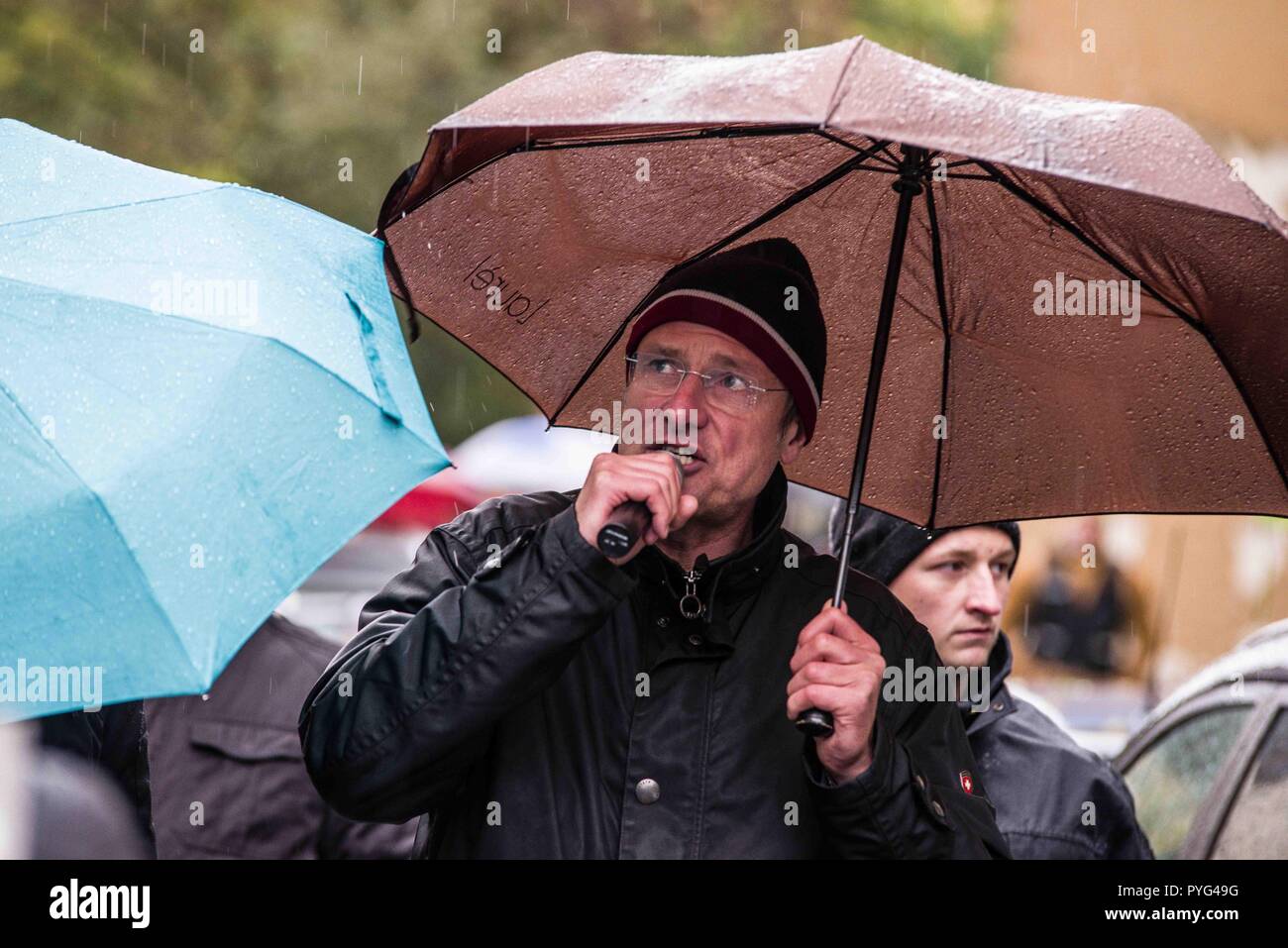 Munich, Bavaria, Germany. 27th Oct, 2018. Islamophobe MICHAEL STUERZENBERGER (StÃ¼rzenberger) leading Pegida Dresden in Munich. Attempting to draw more followers and expand PEGIDA into Bavaria, 'Pegida Dresden'' announced an appearance by founders LUTZ BACHMANN and SIEGFRIED DAEBRITZ in Munich's Neuhausen district. Ultimately, the two did not arrive, leaving approximately 40 Pegida followers to march against over 450 counter-demonstrators. Pegida Dresden in Munich is actually Pegida Nuremburg who is attempting to expand south to Munich where the rival Pegida Muenchen is already acti Stock Photo