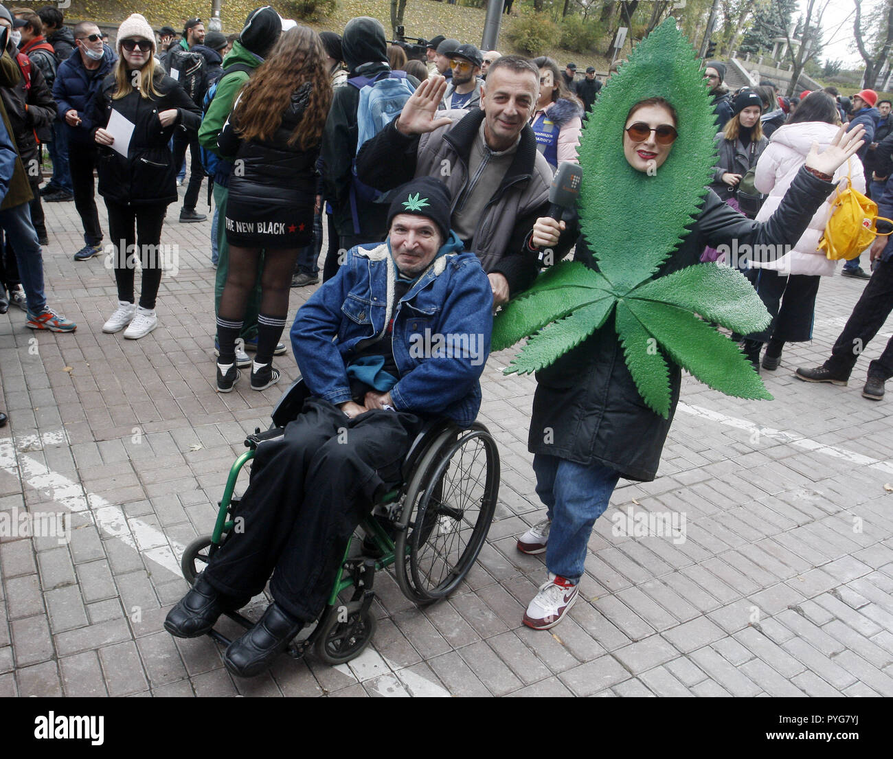 Kiev, Kiev, Ukraine. 27th Oct, 2018. A disabled man is seen on his wheelchair during the protest.March of Liberty 2018 rally for cannabis that took place in front of the Cabinet of Ministers in downtown where a group of protesters have gathered to protest against the decriminalization of marijuana smokers and for allowing the use of marijuana by medical, they also demand that marijuana should be singled out from the hard drugs. Credit: Pavlo Gonchar/SOPA Images/ZUMA Wire/Alamy Live News Stock Photo