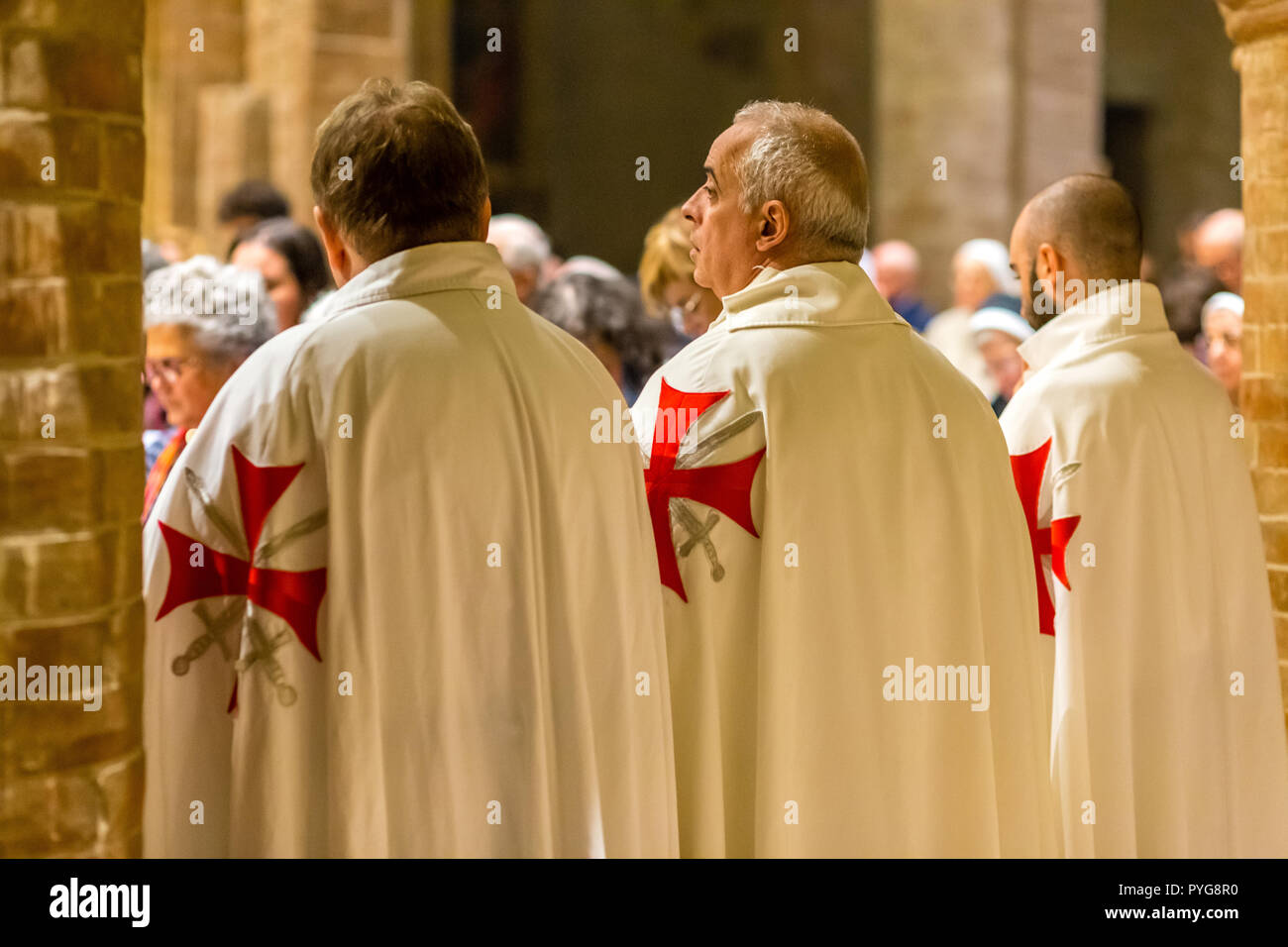 Forli, Italy.  26th October, 2018. Catholic Templar Knights participate in the ritual of Holy Mass during Feast of the Patron Saint. Heirs of the ancient Templar Order suppressed in 1312, Catholic Templars are a private association of faithful Catholics, internally organised as a traditional Christian chivalric order. GoneWithTheWind/Alamy Live News Stock Photo