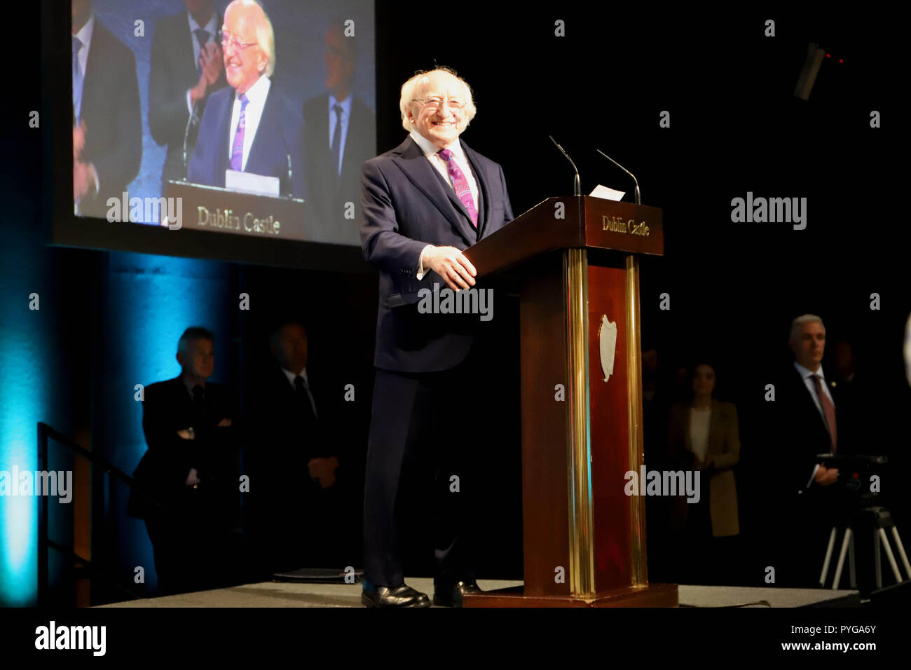 Dublin. 27th Oct, 2018. Irish President Michael D. Higgins (C) delivers a speech after he was re-elected as the president in Dublin, Ireland, on Oct. 27, 2018. Michael D. Higgins has been re-elected as the president of Ireland in the country's 2018 presidential election, announced Barry Ryan, Returning Officer of Presidential Election and Referendum Office here on Saturday night. Credit: Xinhua/Alamy Live News Stock Photo