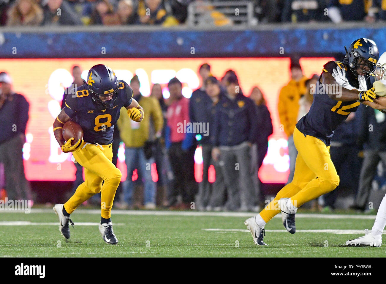 Morgantown, West Virginia, USA. 25th Oct, 2018. West Virginia Mountaineers wide receiver MARCUS SIMMS (8) turn upfield with the ball during the Big 12 football game played at Mountaineer Field in Morgantown, WV. WVU routed Baylor 58-14. Credit: Ken Inness/ZUMA Wire/Alamy Live News Stock Photo