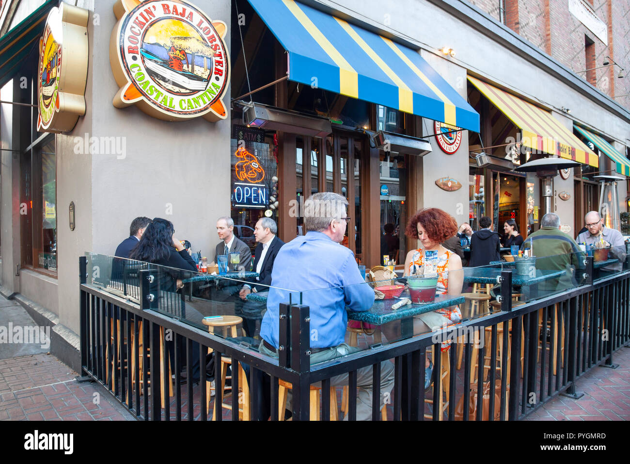 Customers eating in an outdoor seated area outside the Rockin' Baja