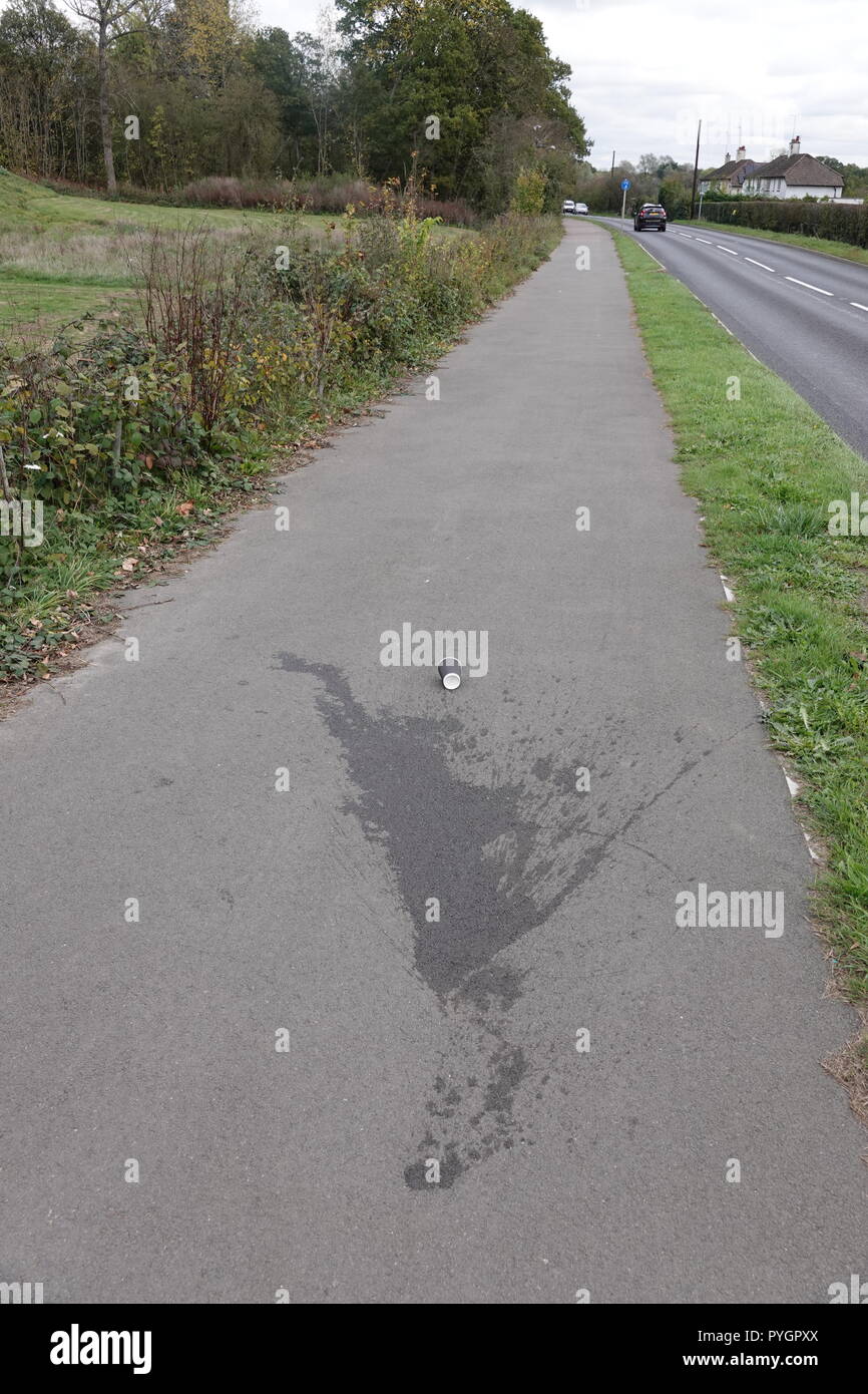 Spilt coffee on tarmac path Stock Photo Alamy