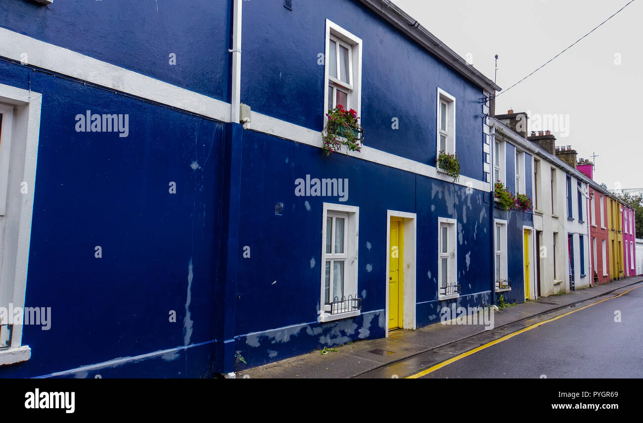 brightly colored painted homes and doors on a street in Dingle, Kerry, Ireland Stock Photo