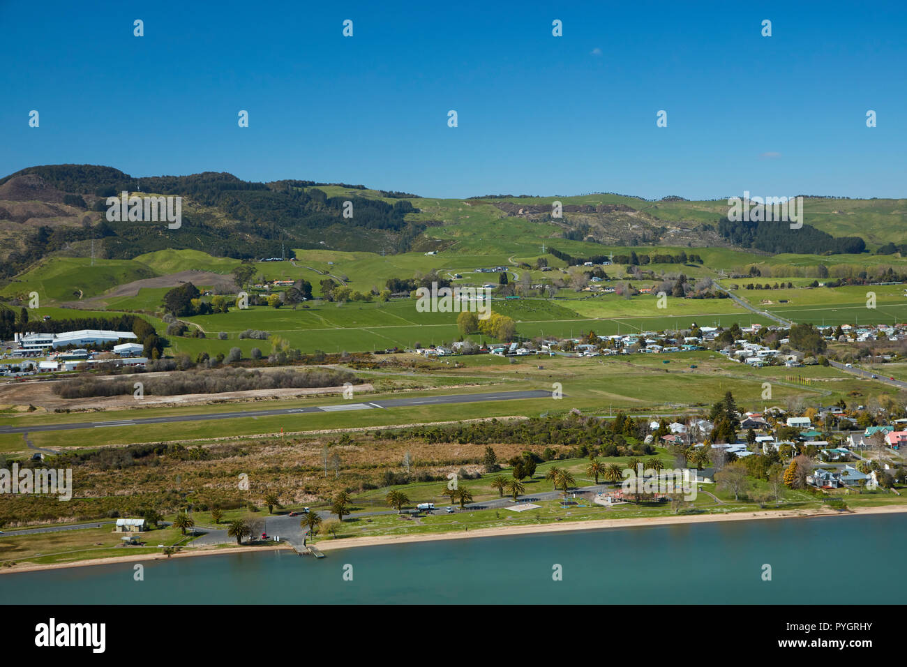 Hannahs Bay / Waikawau, and Rotorua Airport, Rotorua, North Island, New Zealand - aerial Stock Photo