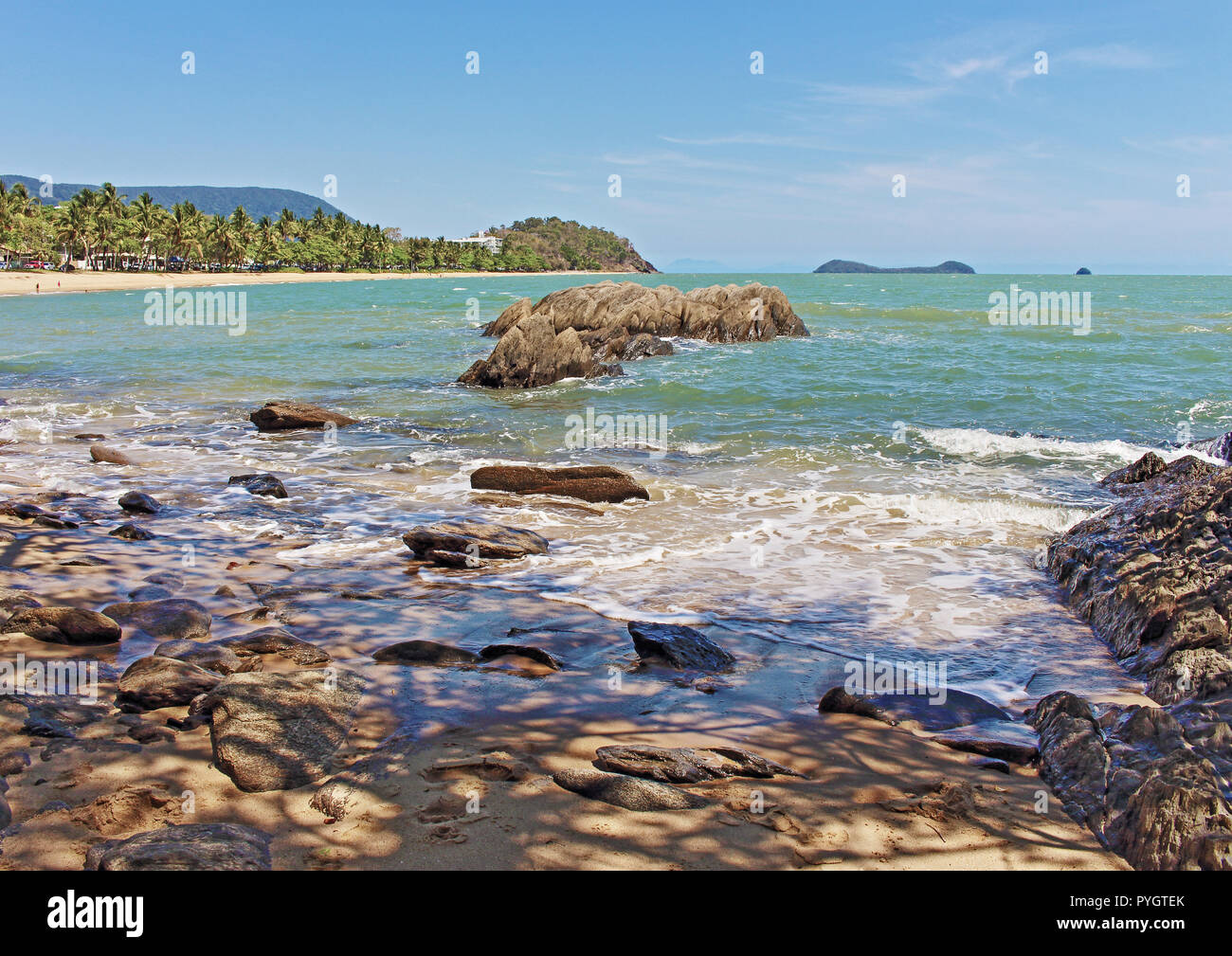 The scenic Trinity Beach from the south end looking northward towards Palm Cove in the Coral Sea. Stock Photo