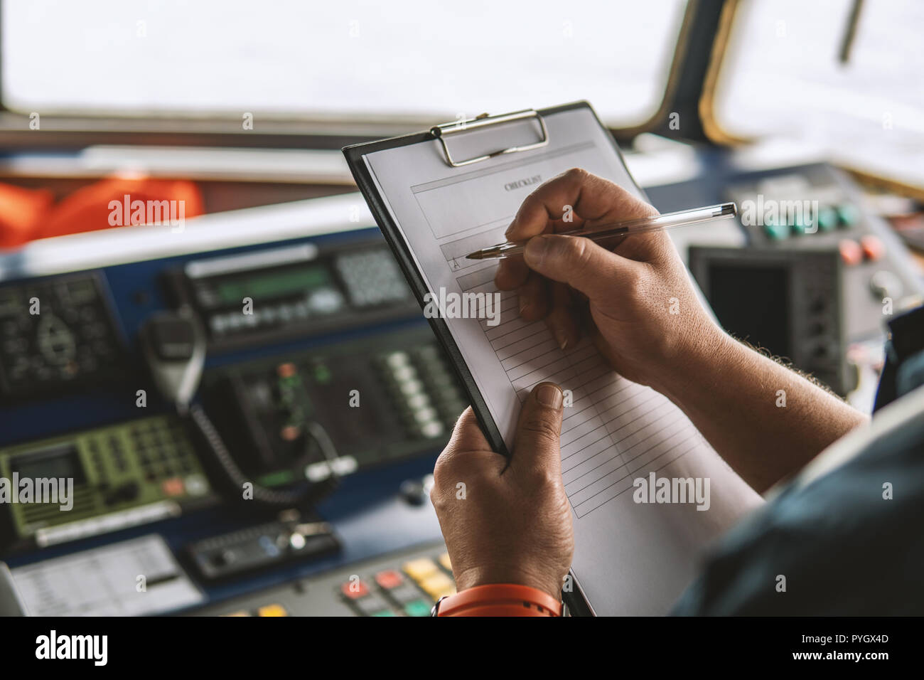 Marine navigational officer or chief mate on navigation watch Stock