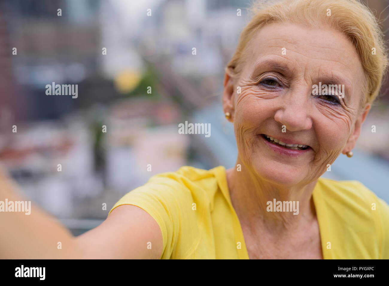 Personal point of view of senior woman taking selfie with mobile phone Stock Photo
