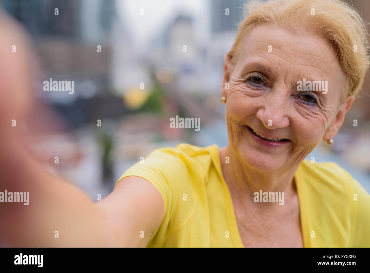 Personal point of view of senior woman taking selfie with mobile phone Stock Photo