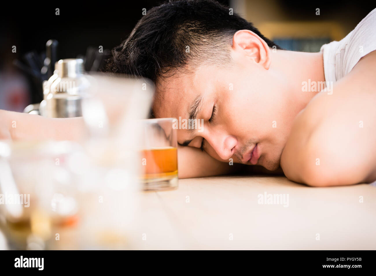 Drunk man with whiskey glass Stock Photo