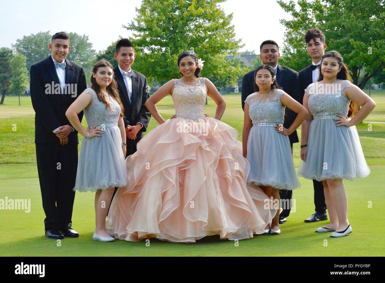 Mexican teenagers posing on golf course for Sweet 16 Stock Photo