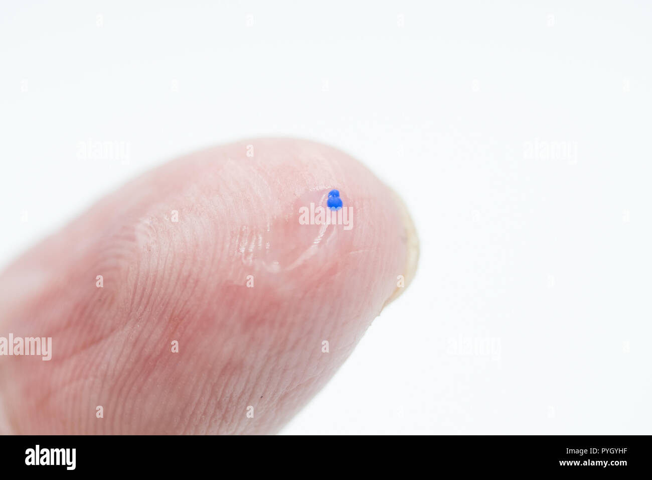 Pollution concept image,body scrub gel focusing on a single  Micro Bead Stock Photo