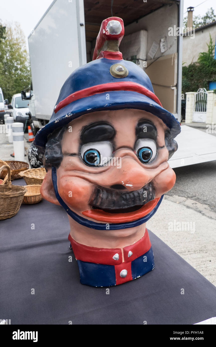 Antique,fireman,cartoon,at,Limoux,outdoor,local,food,market,Aude,department,South,of,France,French,Europe,European, Stock Photo
