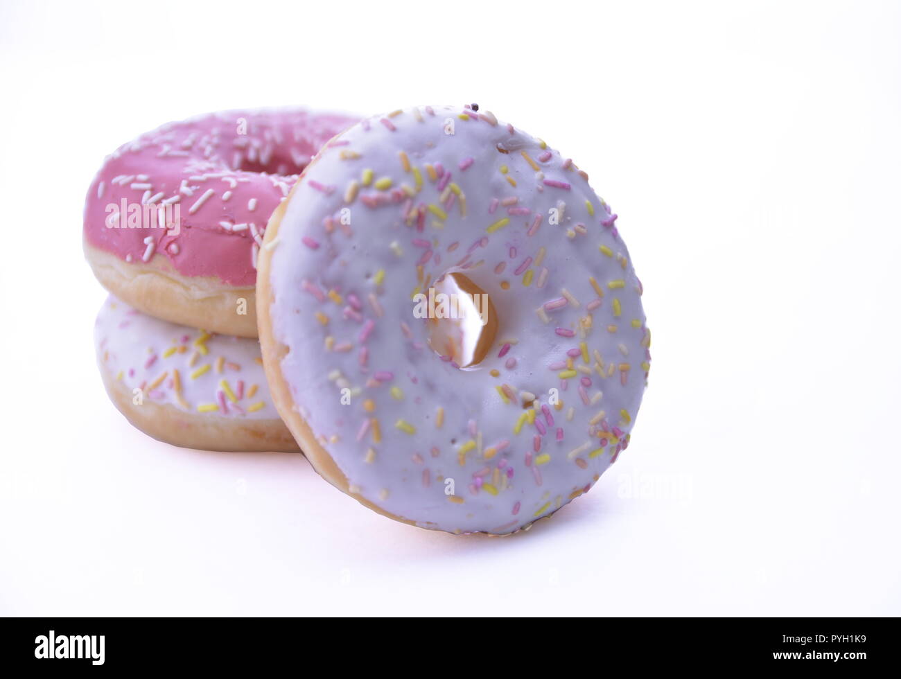 Delicious colorful donuts isolated on white background Stock Photo - Alamy