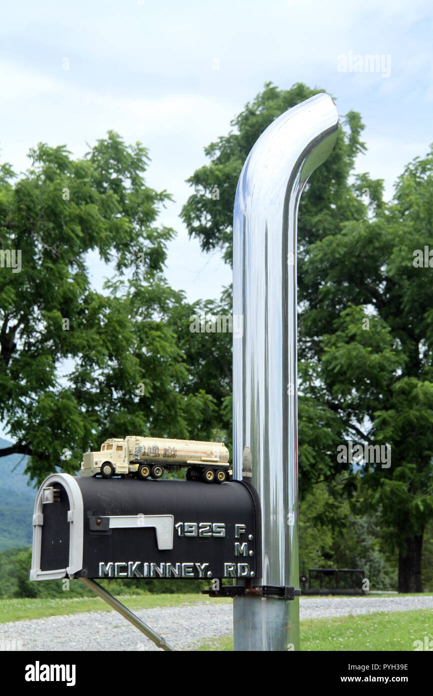 Truck's exhaust stack used as mailbox pole Stock Photo - Alamy