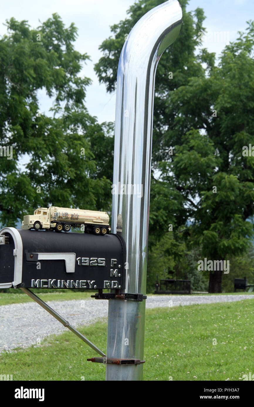 Truck's exhaust stack used as mailbox pole Stock Photo - Alamy