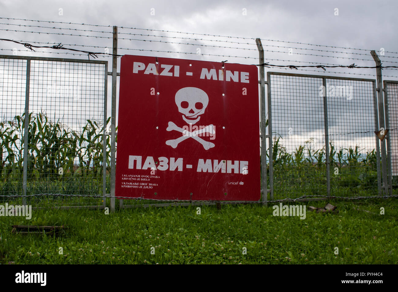 Warning sign for landmines in the reproduction of a minefield at the Sarajevo Tunnel Museum housing the 1993 underground tunnel built during the Siege Stock Photo