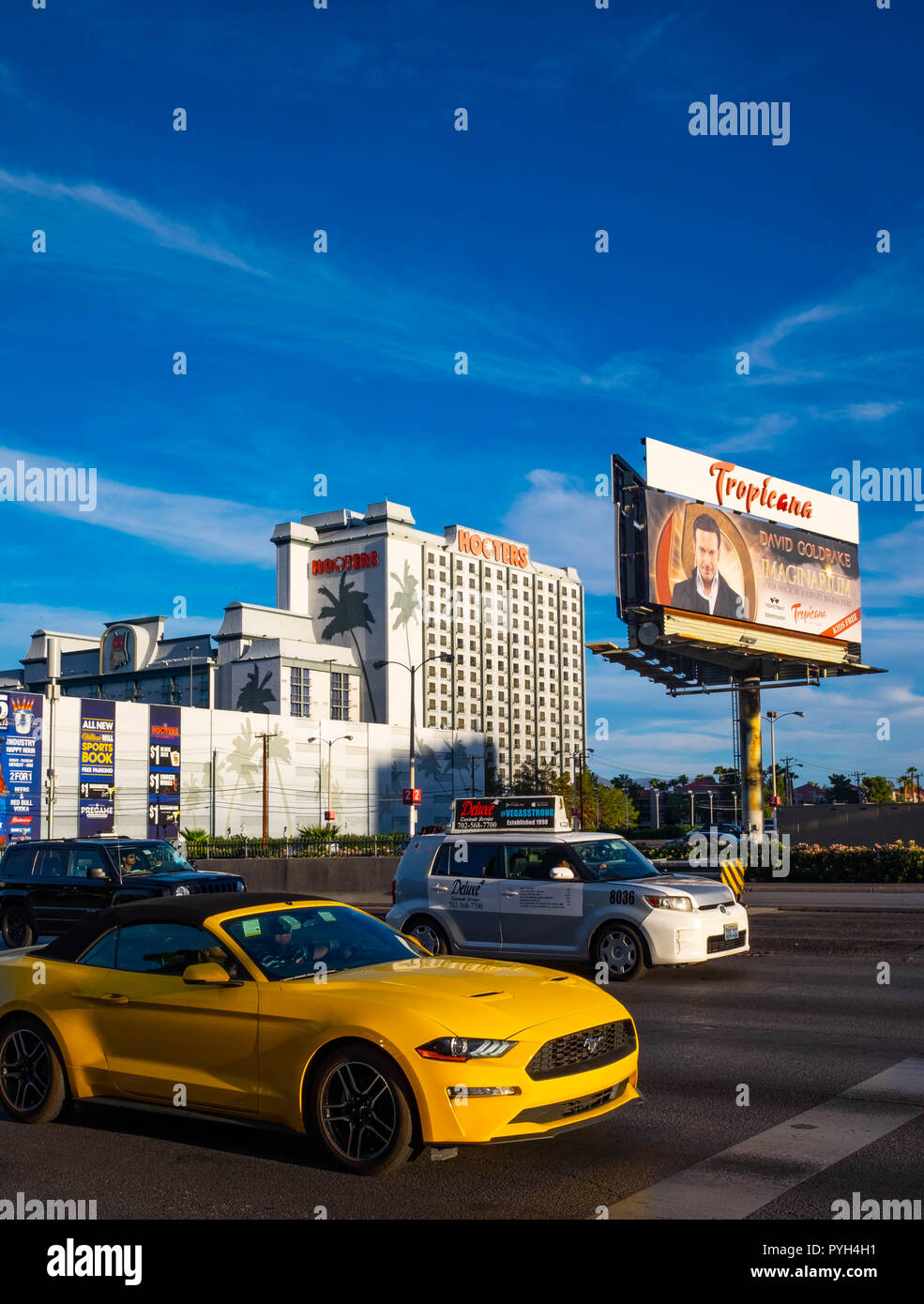 A Ford Mustang waits at the lights outside the Tropicana Resort on Las Vegas Boulevard Stock Photo
