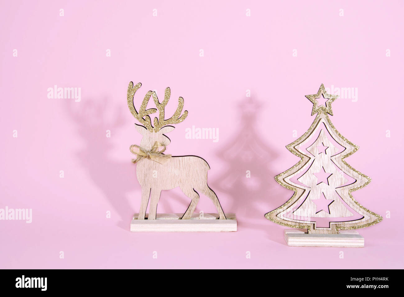 Christmas wooden tree with reindeer over light blue background Stock ...