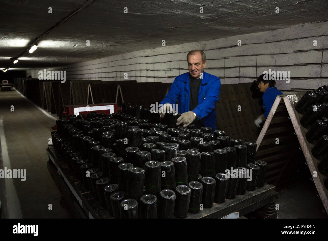 Republic of Moldova, winery Cricova SA, workers sort bottled bottles of sparkling wines for storage Stock Photo