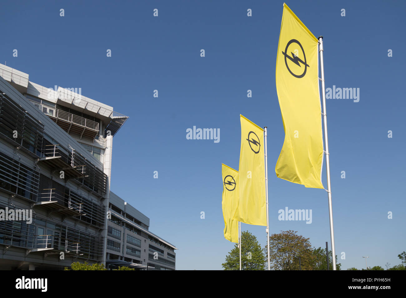 Germany, Ruesselsheim, Opel Automobile GmbH: Flags with Opel logo at group headquarters Stock Photo