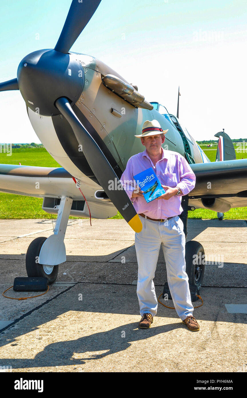 Andy Saunders author of Spitfire Mark I P9374 at the book launch with restored Supermarine Spitfire I Second World War plane subject of the book Stock Photo