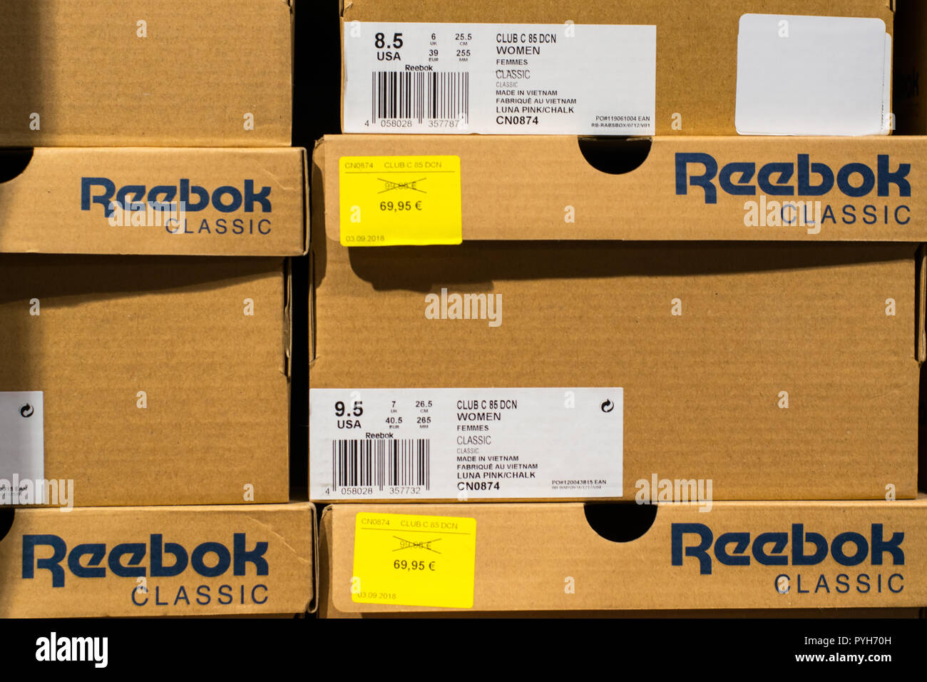 View on boxes with Reebok shoes with old and new prices in Euro Stock Photo  - Alamy