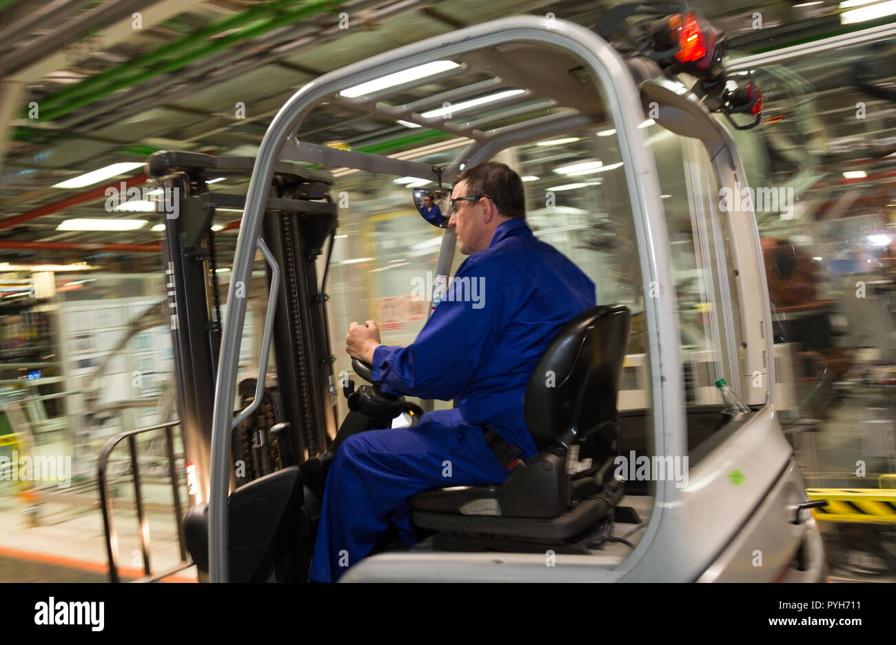 Poland, assembly at Volkswagen Poznan (VW Commercial Vehicles, Caddy and T6), forklift driver delivers parts to Stock Photo