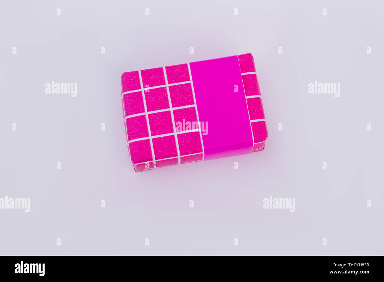 Gift box wrapped in pink paper. Beautiful square present box packed in ...