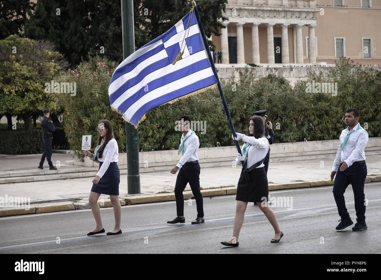 A student seen holding a flag as they take part during the celebrations. The national 'Oxi (No) Day' commemorates the rejection by Greek Prime Minister Ioannis Metaxas of the ultimatum made by the Italian dictator Benito Mussolini on 28 October 1940 during World War II.  It is celebrated yearly by Greek communities around the world, in Greece and Cyprus. After World War II it became a public holiday in Greece and Cyprus and the event is commemorated every year with military and student parades. On every anniversary, most public buildings and residences are decorated with Greek flags. Stock Photo