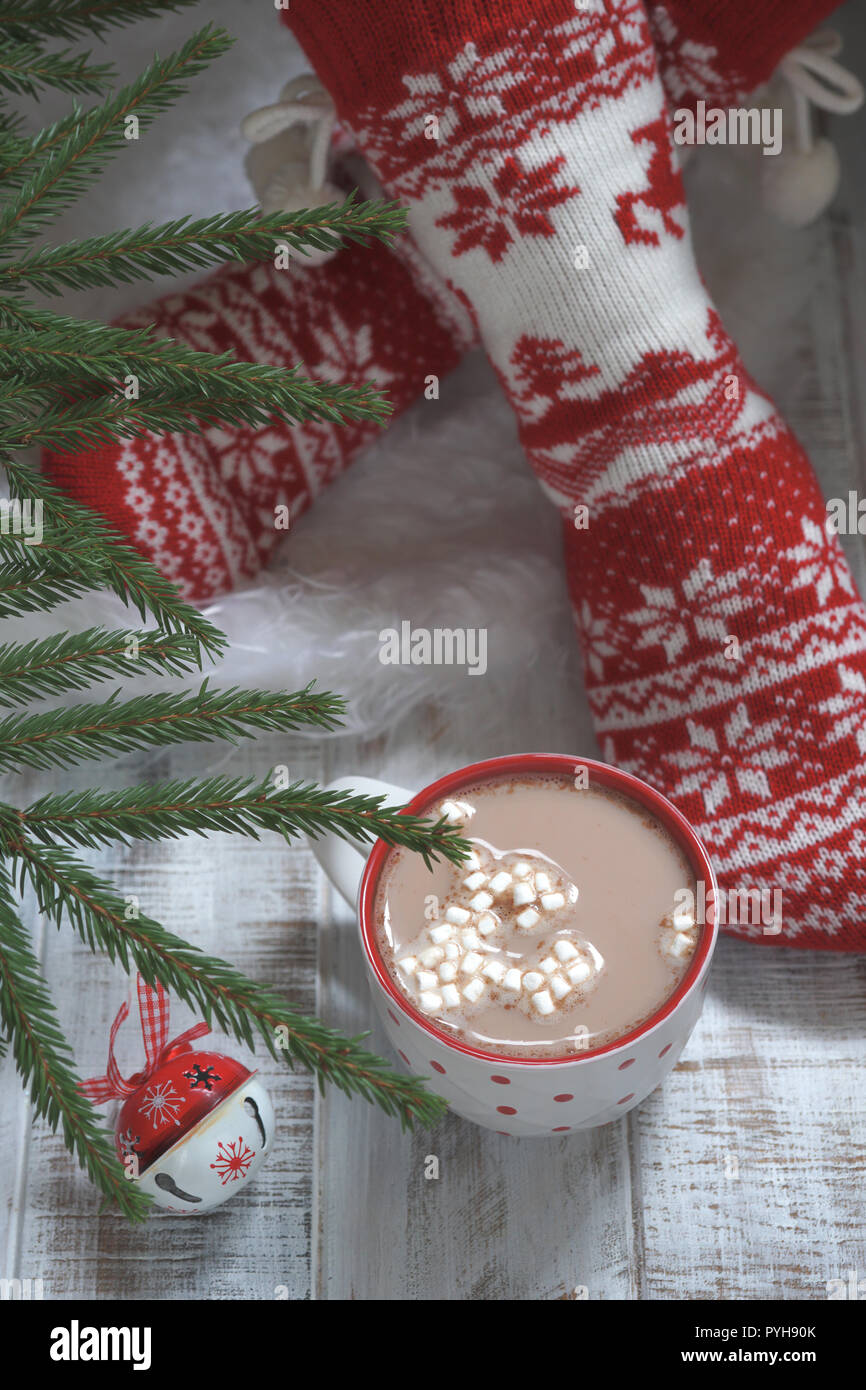 Woman in Christmas socks and hot chocolate drink. Winter holiday Xmas and New Year concept Stock Photo