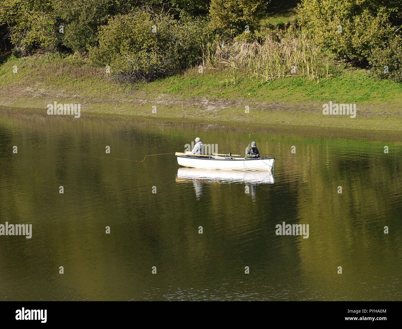 Two men fishing from a boat hi-res stock photography and images - Alamy