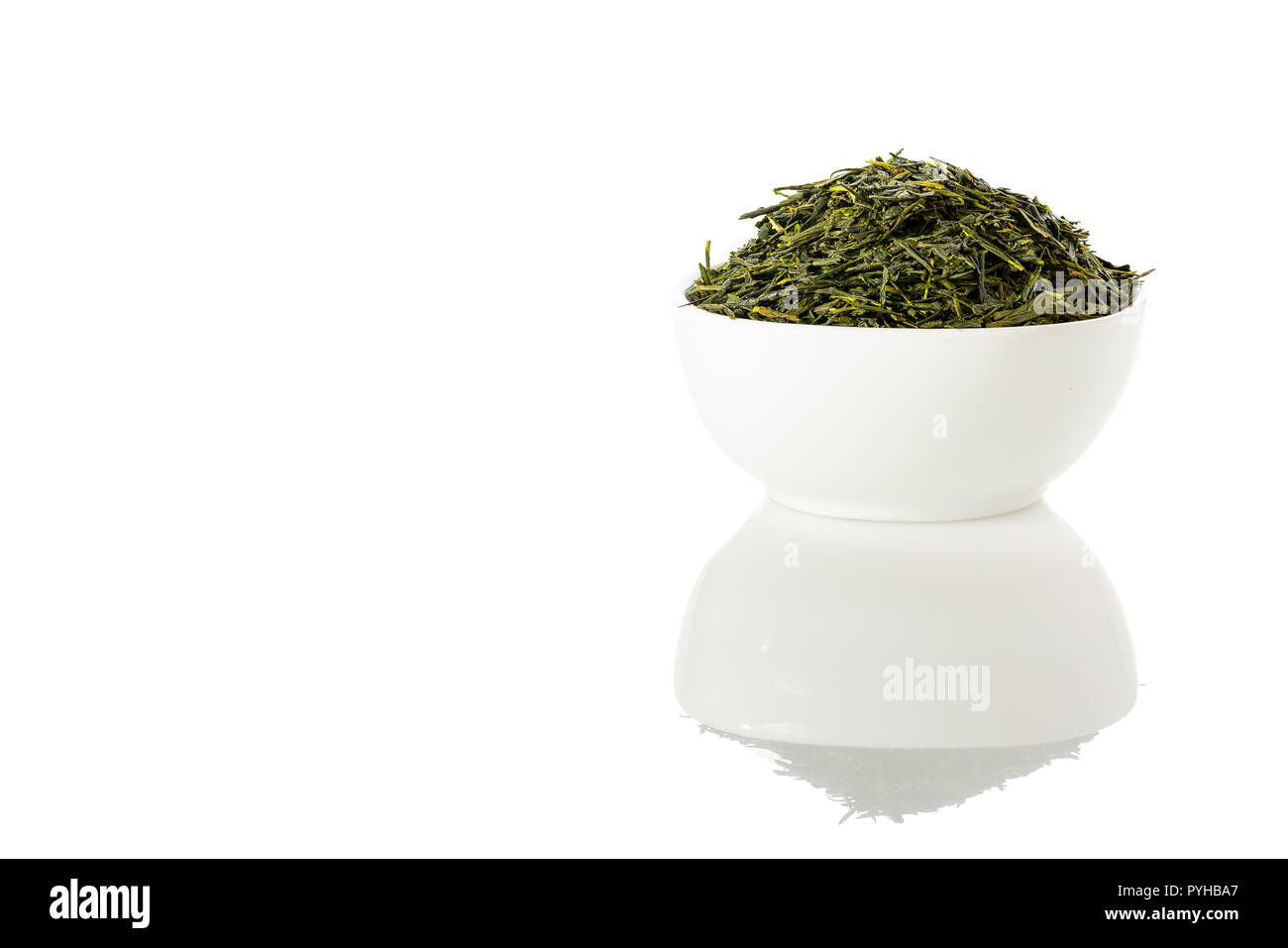 Green sencha tea in white cup isolated on white background. Stock Photo