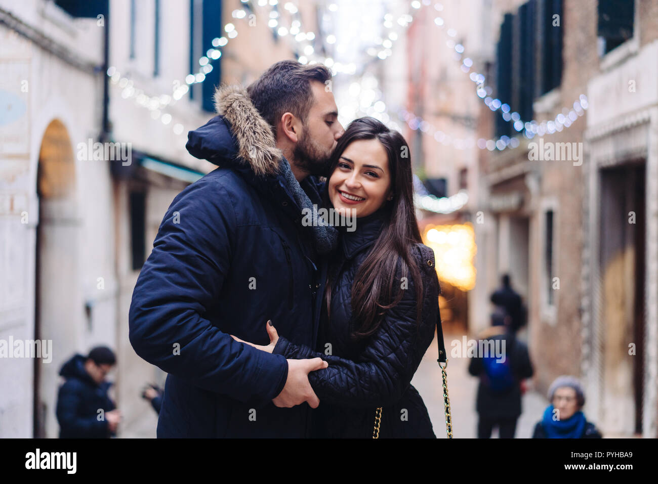 Boy girl kissing female friend hi-res stock photography and images - Alamy