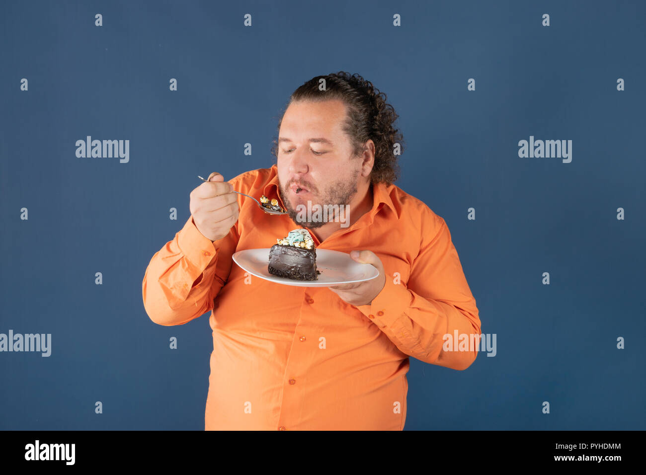 Fat man in orange shirt hi-res stock photography and images - Alamy