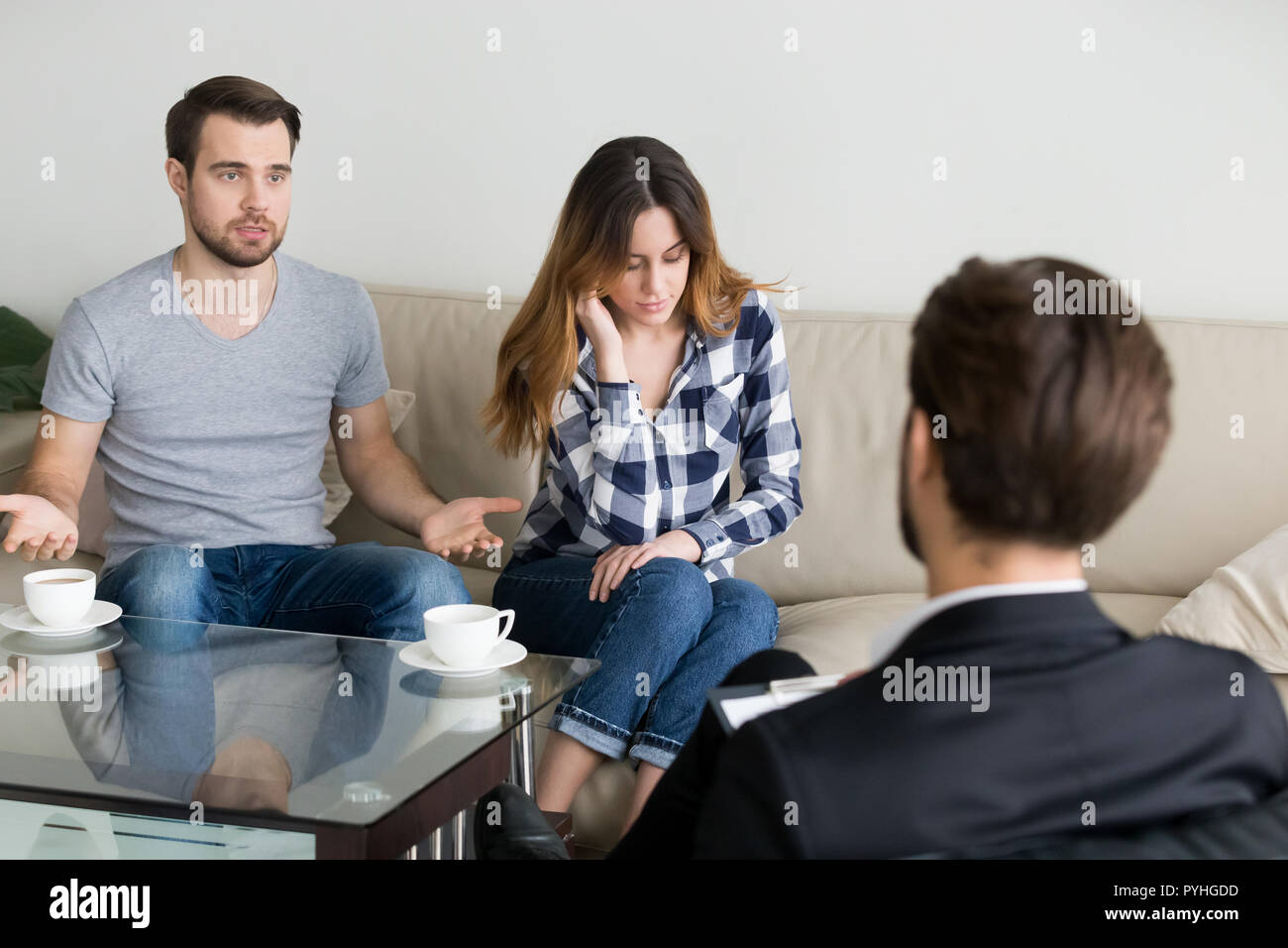 Young couple, family at meeting with psychologist counselor Stock Photo