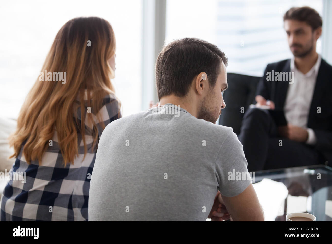 Young couple, family at meeting with psychologist counselor Stock Photo