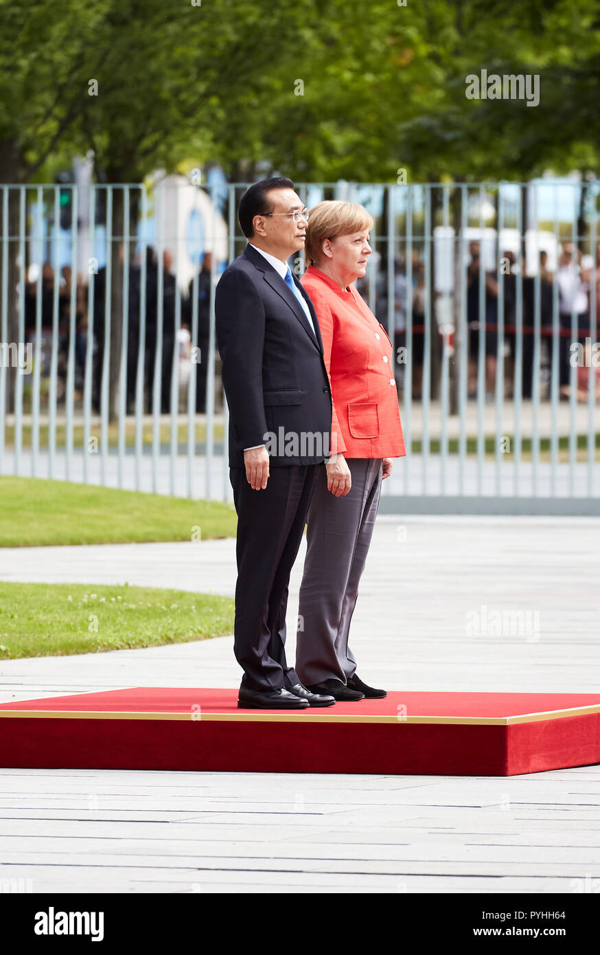 Berlin, Germany - Chancellor Angela Merkel receives Chinese Prime Minister Li Keqiang with military honors in the Federal Chancellery's courtyard of honor. Stock Photo