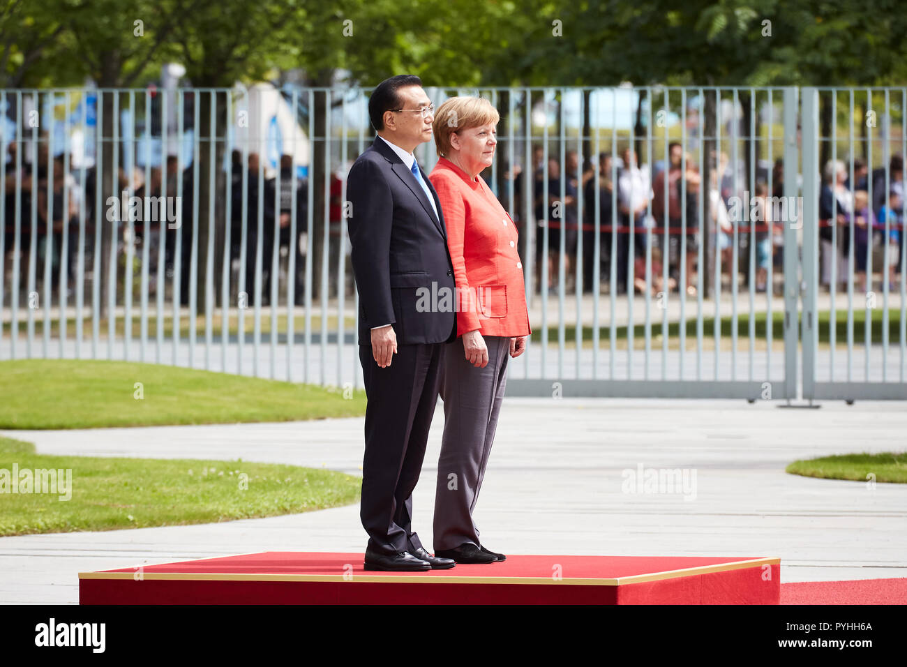 Berlin, Germany - Chancellor Angela Merkel receives Chinese Prime Minister Li Keqiang with military honors in the Federal Chancellery's courtyard of honor. Stock Photo