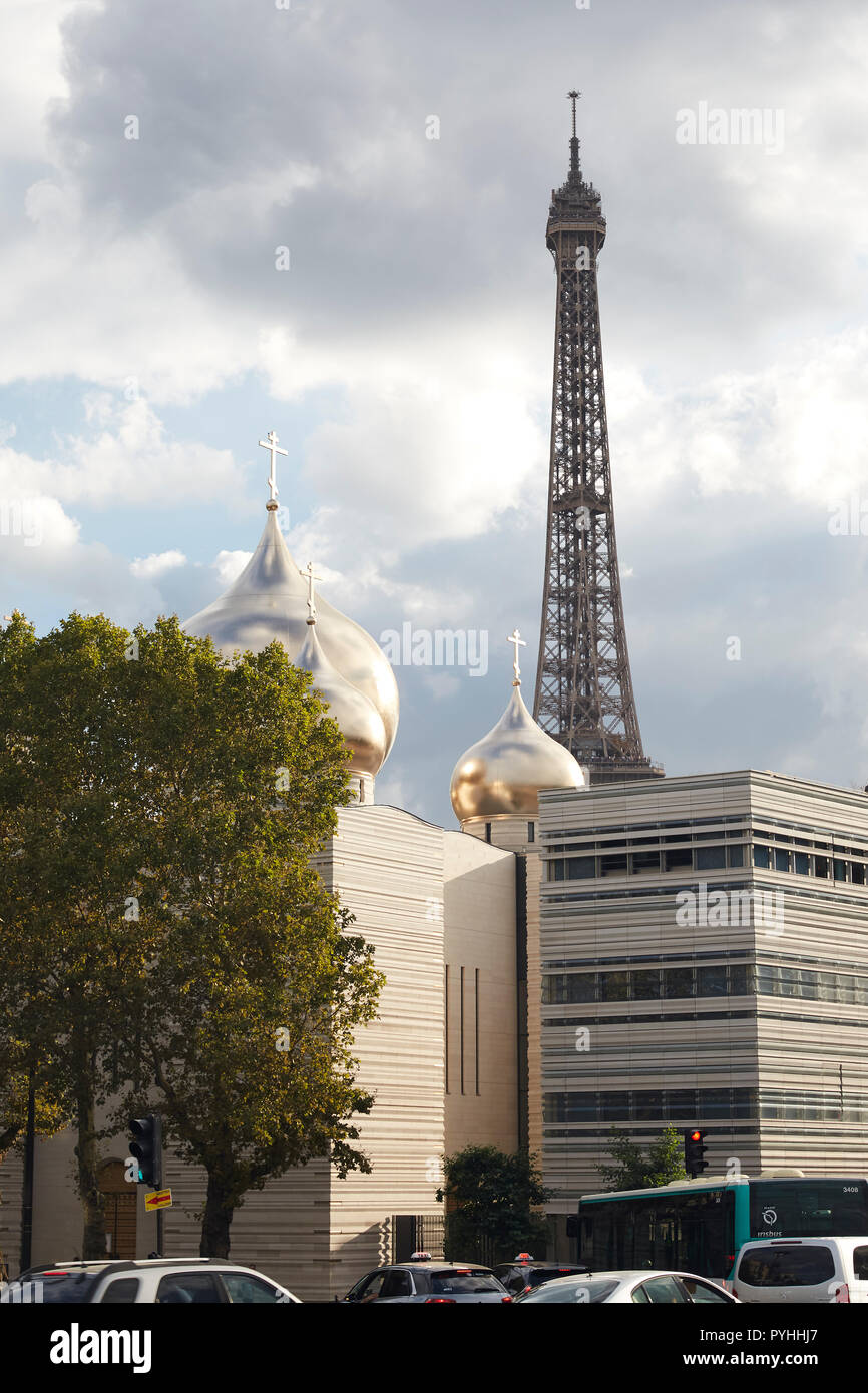 Paris, Ile-de-France, France - The Cathédrale de la Sainte-Trinité with the Eiffel Tower in the background. Stock Photo