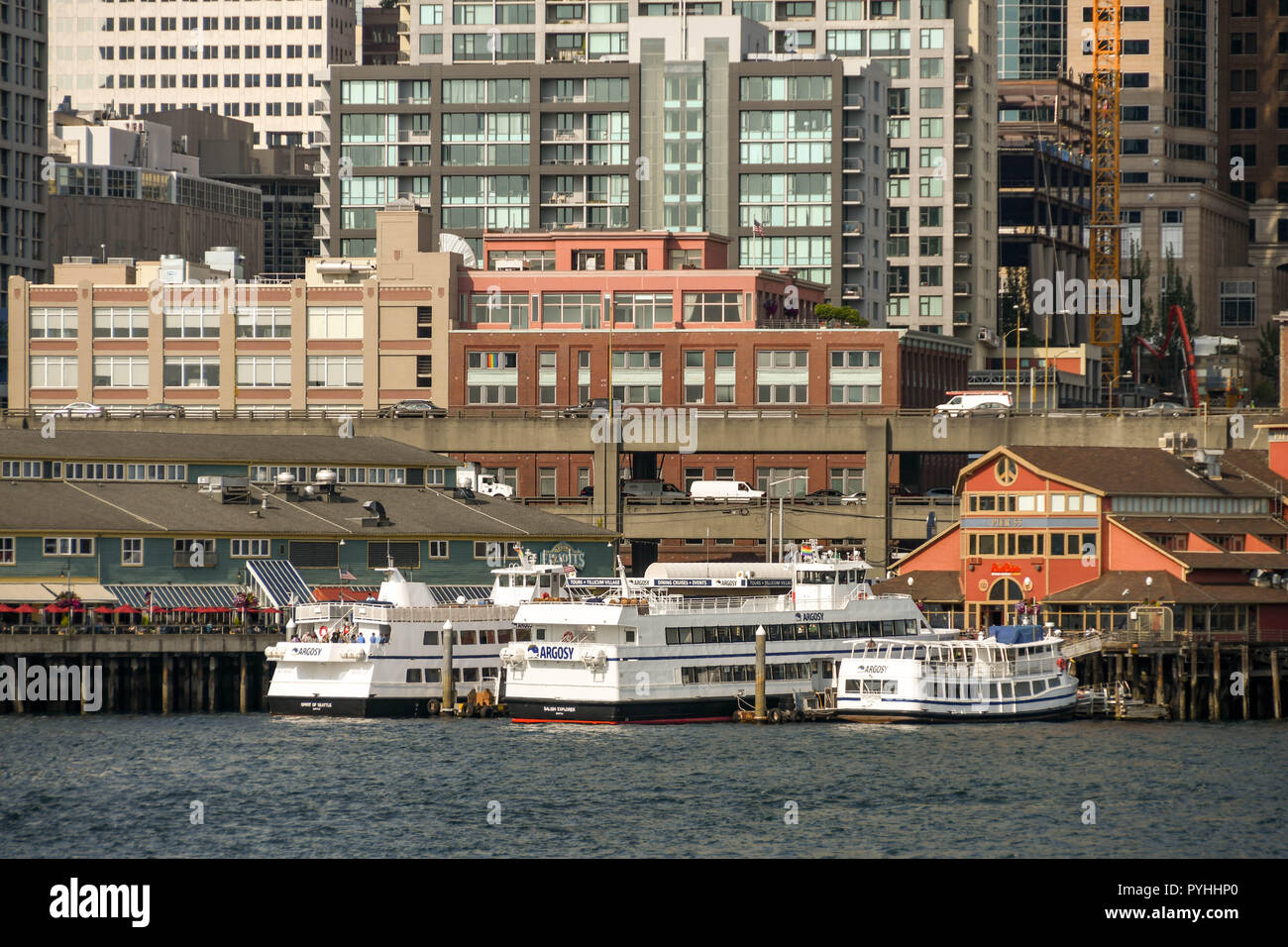 SEATTLE, WASHINGTON STATE, USA - JUNE 2018: Sightseeing cruise boats operated by Argosy berthed at Pier 55 in Seattle. Stock Photo