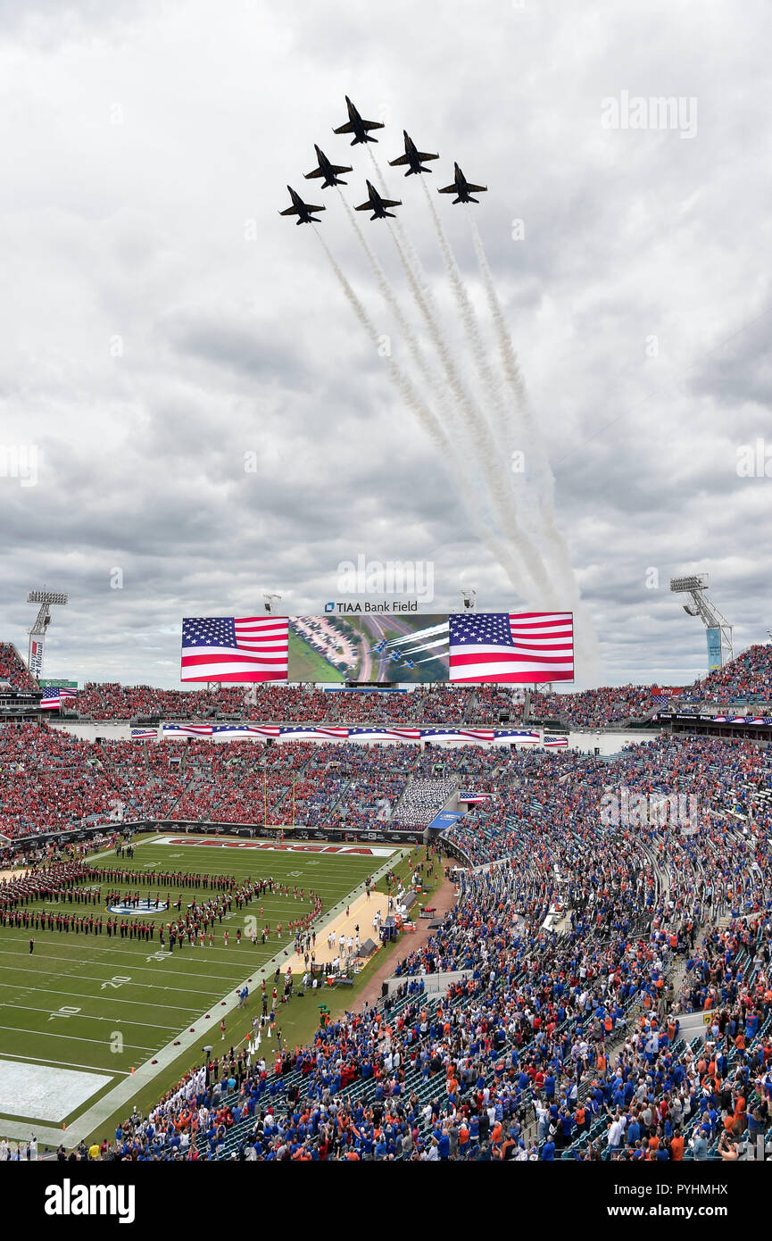 181027-N-UK306-1054 JACKSONVILLE, Fla. (Oct. 27, 2018)  The U.S. Navy Flight Demonstration Squadron, the Blue Angels, perform a flyover after  the playing of the national anthem during the Georgia vs. Florida college football game at TIAA Bank Stadium in Jacksonville. The Blue Angels are scheduled to perform more than 60 demonstrations at more than 30 locations across the U.S. and Canada in 2018. (U.S. Navy photo by Mass Communication Specialist 2nd Class Timothy Schumaker/Released) Stock Photo